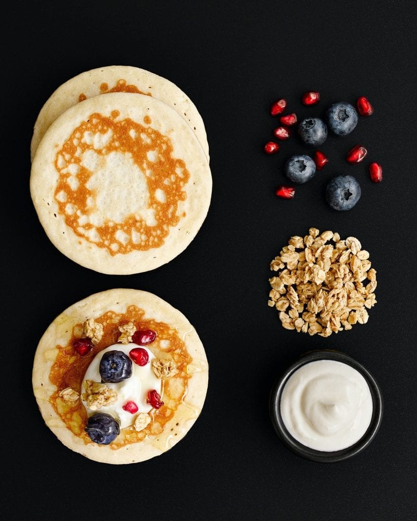 M&S Pancakes served with yoghurt, granola, pomegranates and blueberries shot for Marks and Spencer for breakfast.