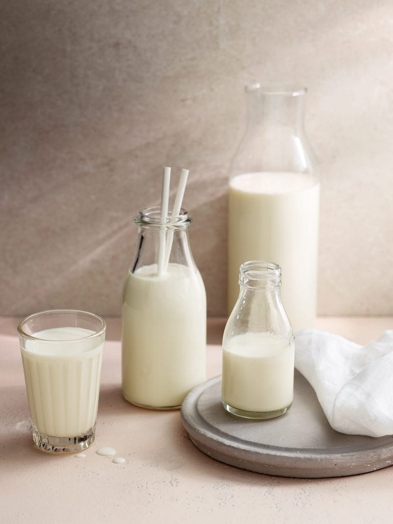 milk glasses bottles in various sizes